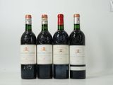 quatre bouteilles de vin sont alignées sur une table