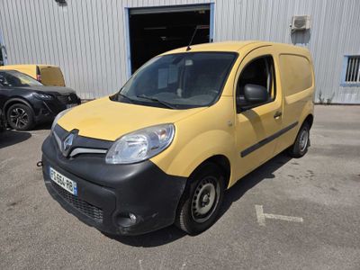 yellow and black van parked in front of a building in a parking lot