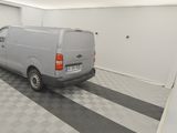a van that is parked in a room with a checkered floor