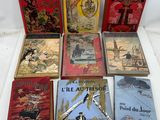 six children ' s books are lined up on a white surface
