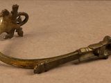 an image of a brass handle with a bird on it
