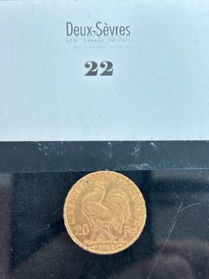 a gold coin on display in a glass case