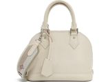 the small white bag is sitting on a white surface