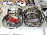 a lot of metal rings in a box on a table