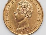 une vieille pièce d'or sur laquelle figure le portrait d'un homme