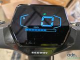 a close up of a digital clock on the handlebar of a bike