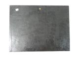 a close up of a piece of black slate on a white background