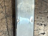 a metal object that is on a wooden floor