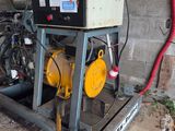 a machine that is sitting on the ground next to a wall