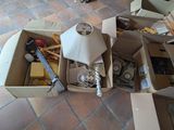 a pile of boxes and a lamp on the floor
