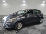 a grey car is parked on a checkered floor in a garage