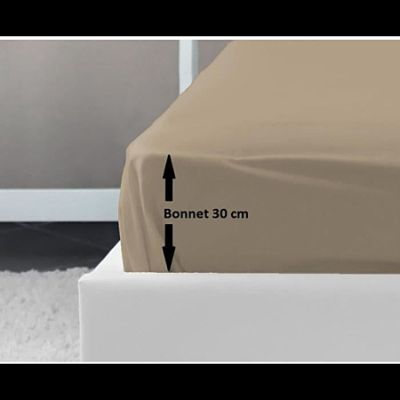 an image of a bed with a brown cover and a black arrow pointing to the bottom