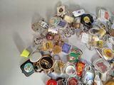 a lot of key chains that are sitting on a table
