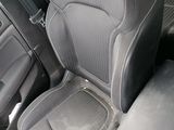 the interior of a car with two seats and a steering wheel