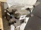 a machine that is sitting on the floor next to a wall
