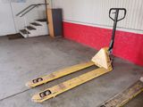 two pallets sitting on the floor in a garage