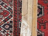a picture of a pair of skis sitting on a rug