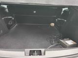 a car trunk with a lot of electronics in it