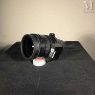 a camera lens sitting on top of a black table