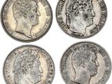 quatre types différents de pièces d'argent, dont l'une représente la tête d'une femme et une autre est