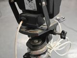 a camera that is on a tripod in a room