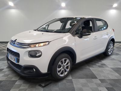 the white citrole is parked on a checkered floor