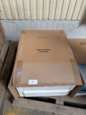 a box that is sitting on a pallet next to some boxes