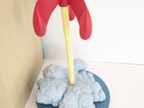 a toy rocket that is sitting on top of a table