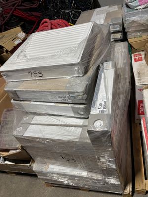 a pile of electronic equipment sitting on top of a pile of boxes