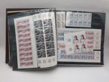 an open book with stamps on it on a table