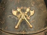 a helmet with two crossed axes on the side of it