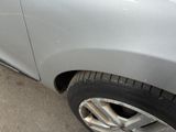 a close up of a car ' s tire on the street