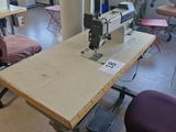a sewing machine sitting on a table in a room