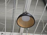 three lamps hanging from the ceiling of a building