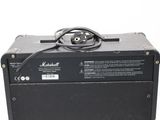 a black amp sitting on top of a white table