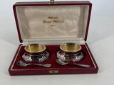 pair of silver plated bowls and spoons in a red case