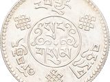 an image of a silver coin with a design on it