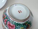 a white bowl with a floral design on it