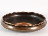 an image of a wooden bowl with a rope around it