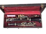 two clarinets in a case on a white background