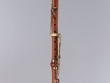 a clarinet with a wooden body and a black top