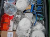 a box full of assorted items sitting on the ground