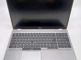 an open laptop computer sitting on top of a white table
