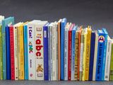 a lot of books that are sitting on a table