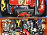 many different types of toy cars in a box