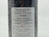 a bottle of wine that is wrapped in plastic