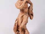 an image of a statue of a man holding a bag