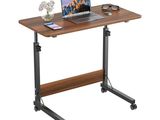 the laptop is sitting on top of a wooden desk
