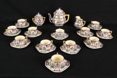 a close up of a group of cups and saucers on a table