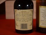 two bottles of wine sitting on a red table